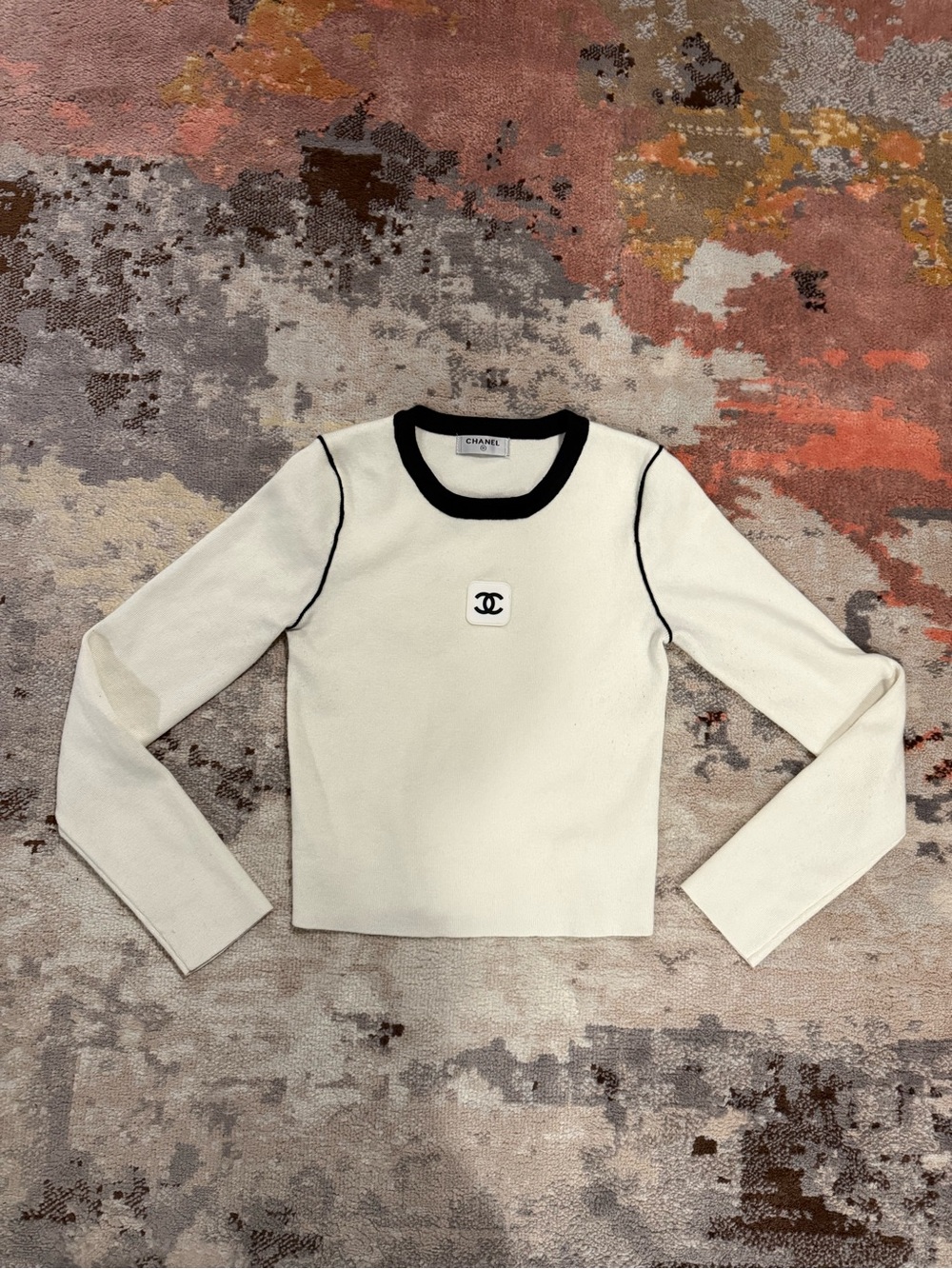 CHANEL Cream Long Sleeve Top with Black Trim and CC Emblem